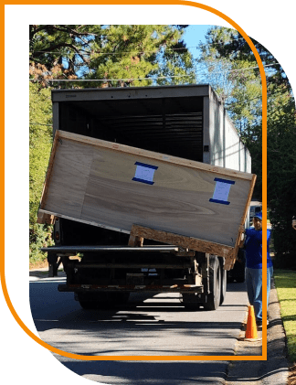 man unloading window doors